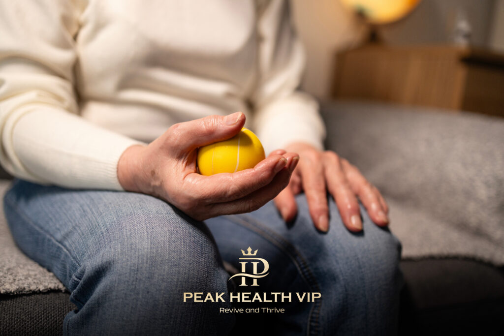 Senior woman exercising hand with therapy ball relieving arthritis