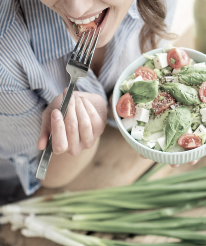 woman eating healthy salad gm669584224 122363877